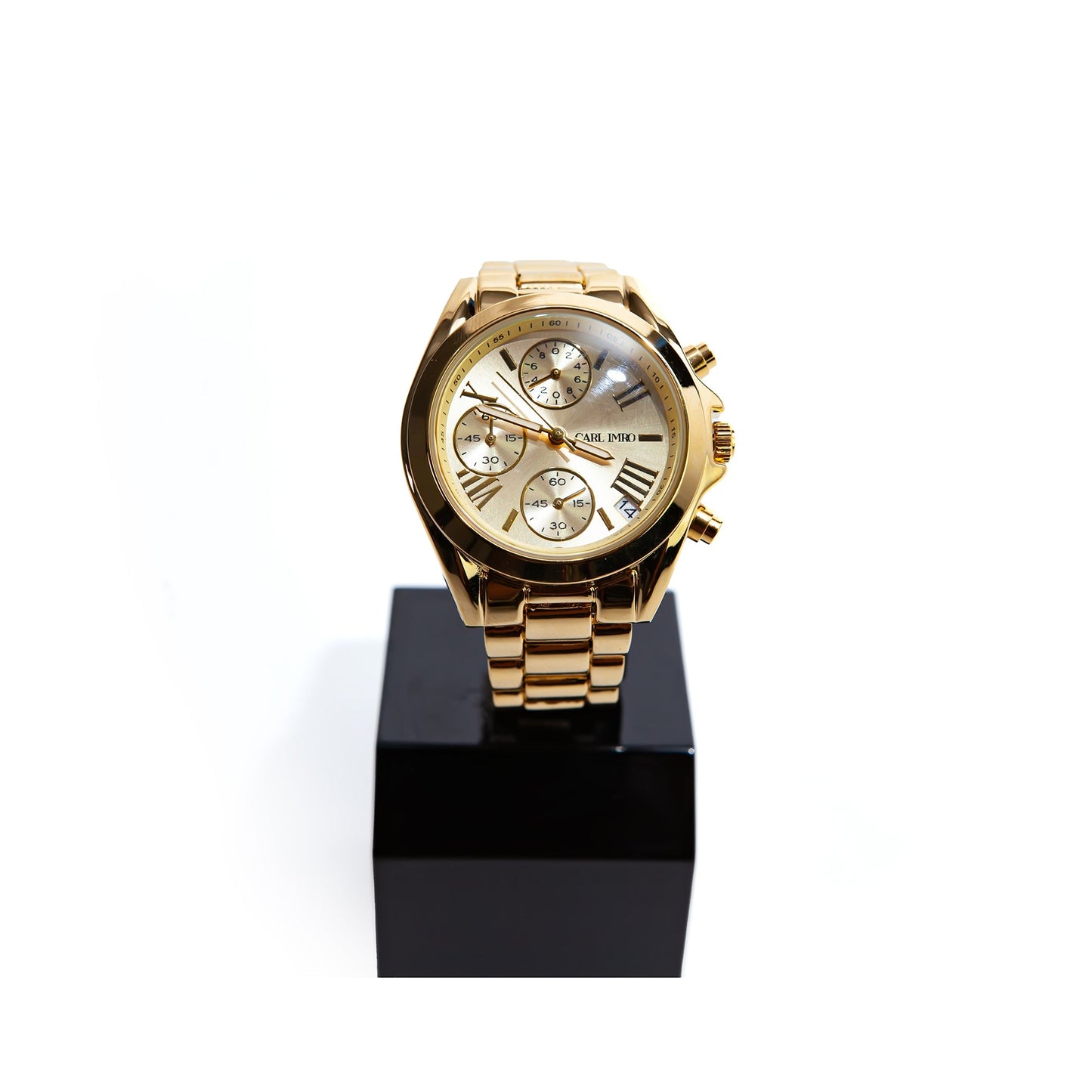 Montre femme à bracelet maillons dorés et cadran doré, trois sous-cadrans.