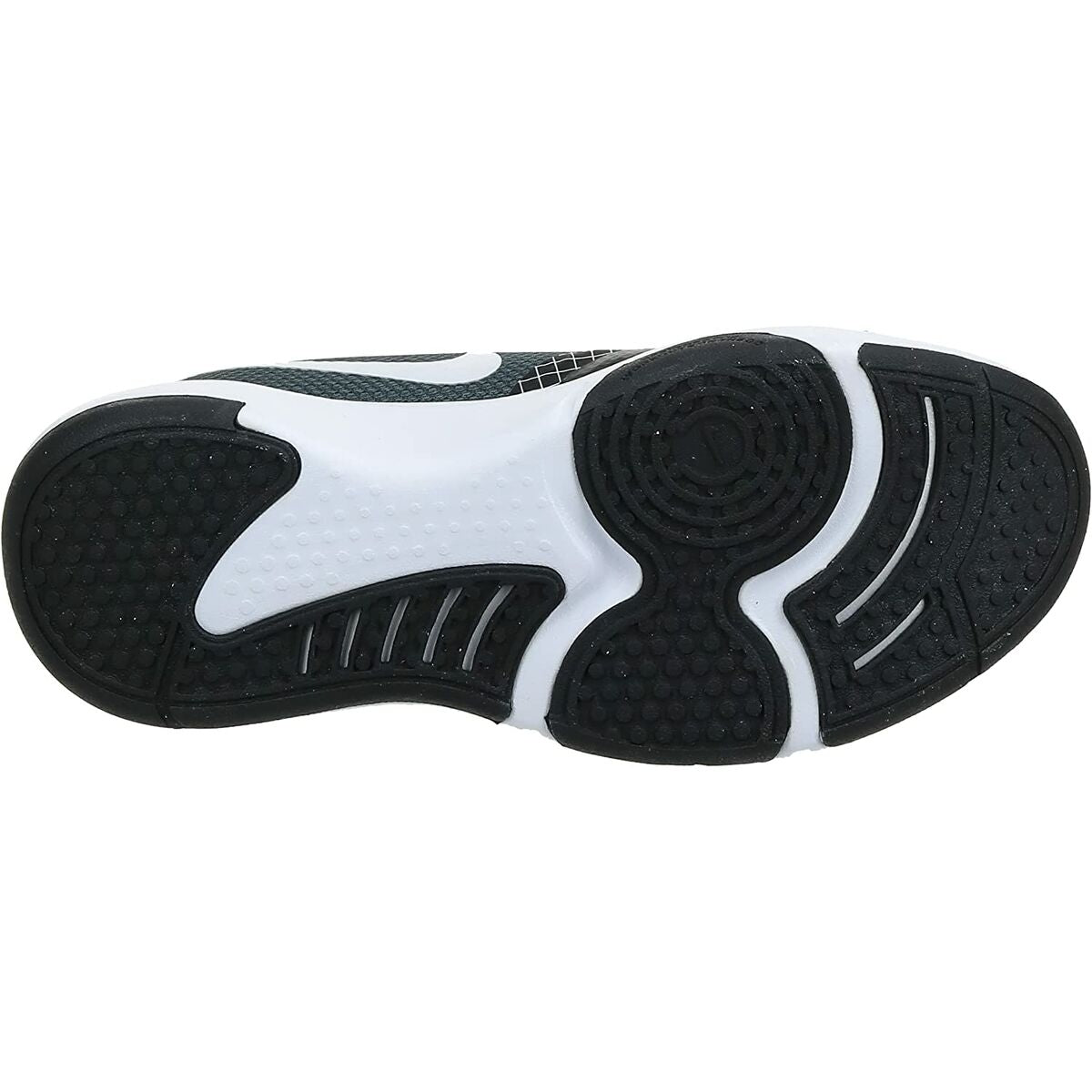 Semelle extérieure de baskets Nike: crampons noirs et zones de traction blanches