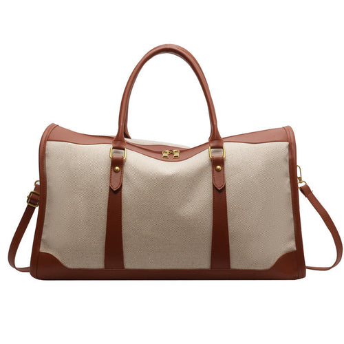 Sac de voyage en toile beige, anses et détails marron, bandoulière amovible