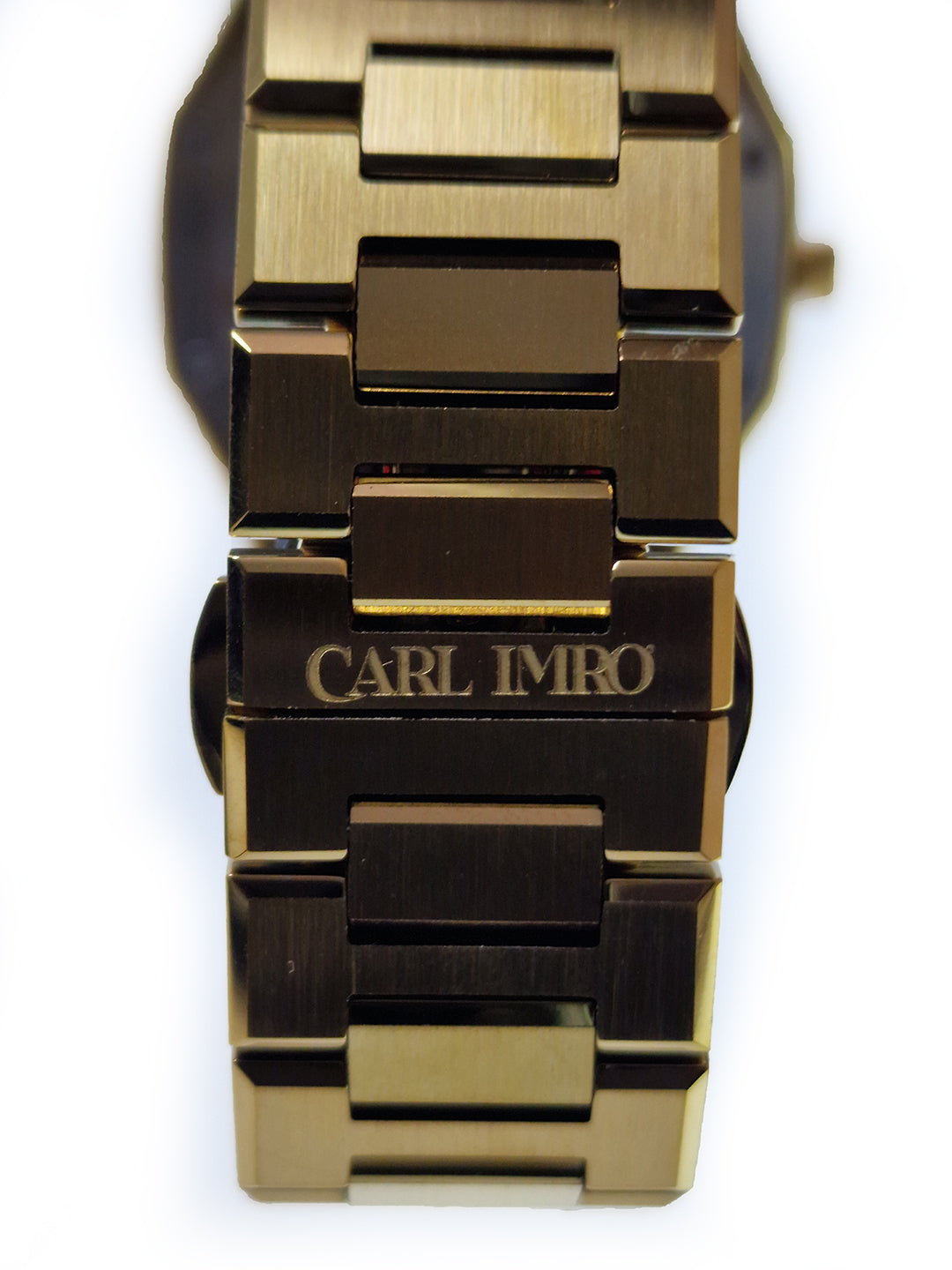 Bracelet et fond de montre acier doré, inscription CARL IMRO sur le boîtier.