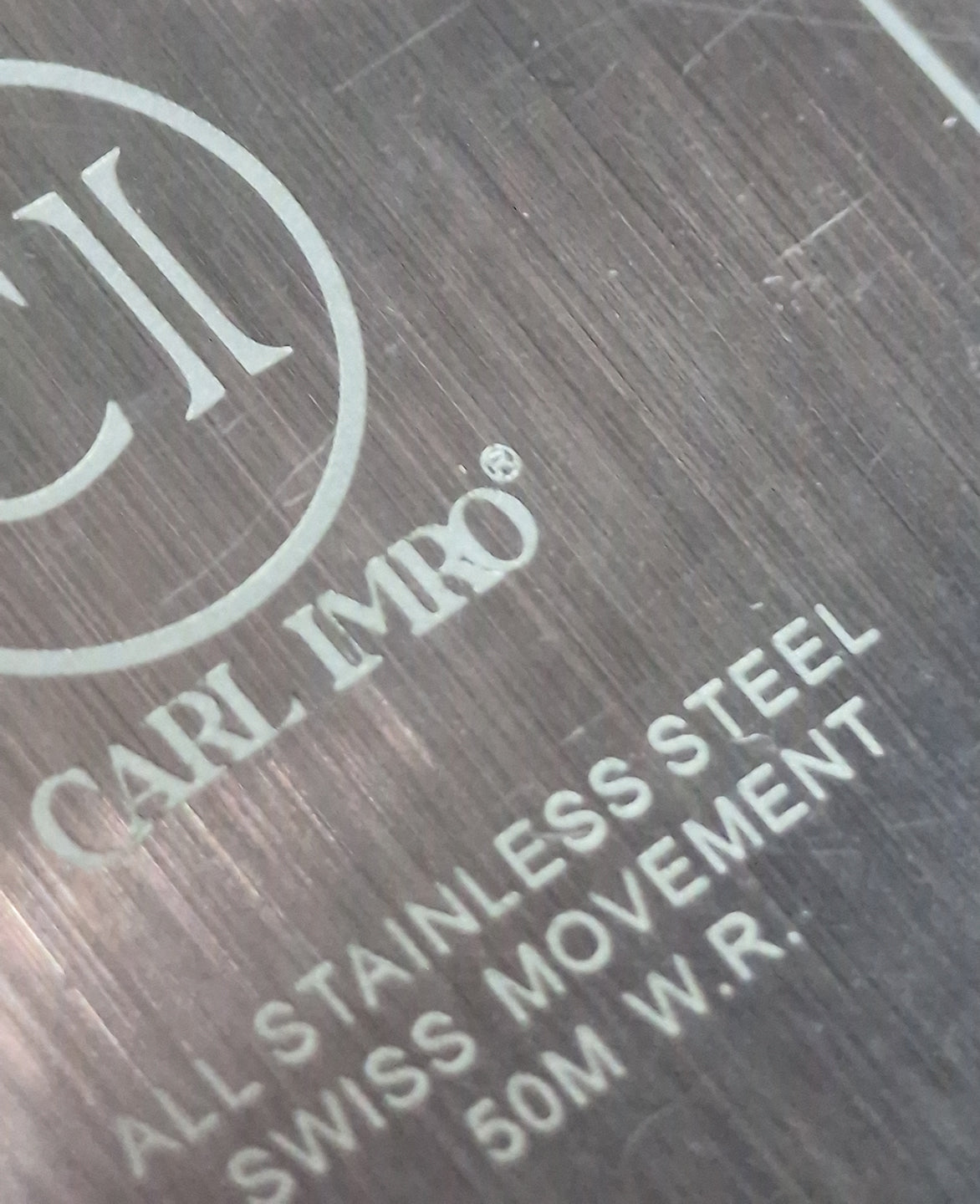 Inscription sur boîtier: CARL IMRO, Swiss Steel, 50M W.R., acier.