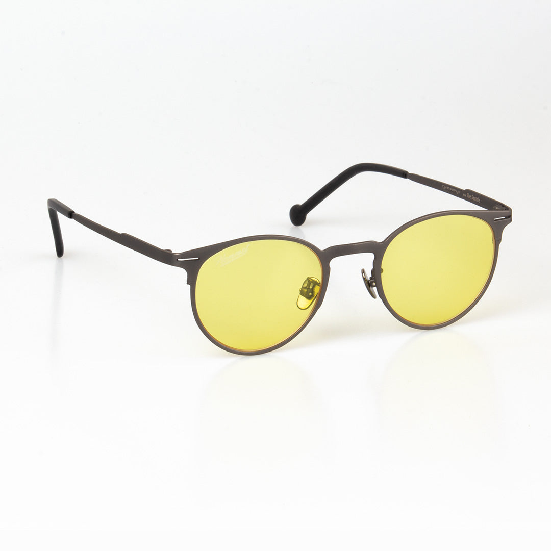 Lunettes de soleil unisexes, monture sombre et verres jaunes à reflets