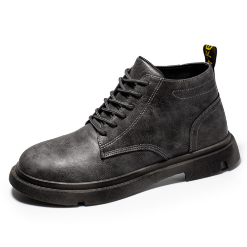 Bottes montantes en cuir suédé gris foncé, lacets, semelle épaisse et bout arrondi.
