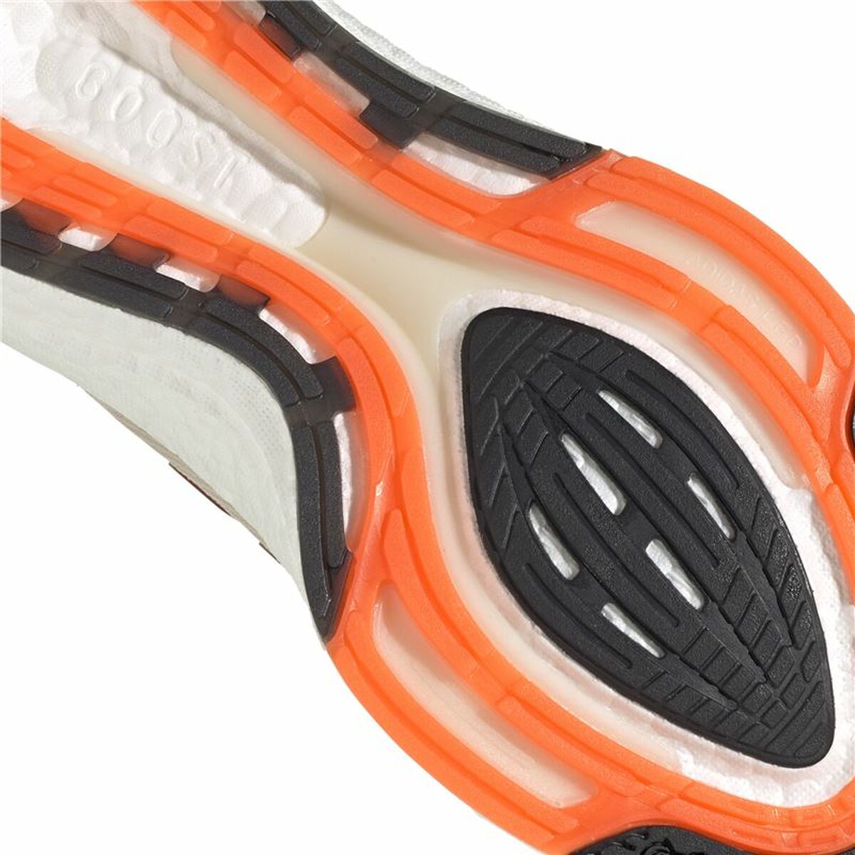 Semelle extérieure orange avec motifs de traction noir, partie avant