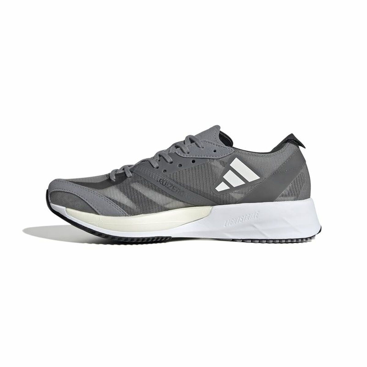 Chaussure de running Adidas grise foncée à semelle blanche, lacets et empiècements