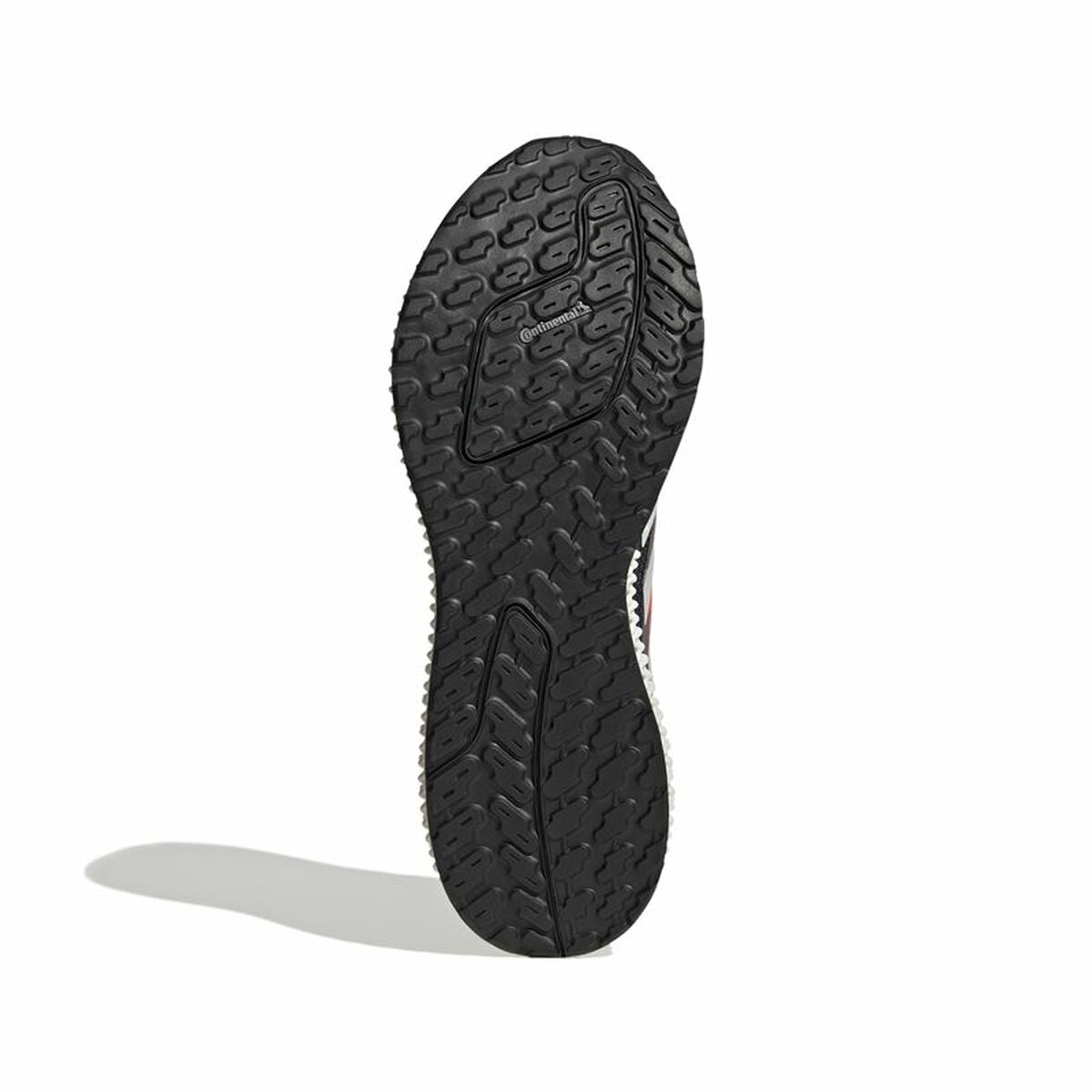 Semelle extérieure noire de chaussure Adidas, motif antidérapant et talon.