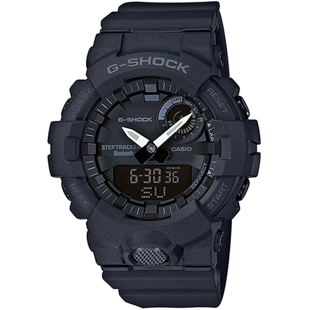 Montre G-Shock noire à bracelet caoutchouc, cadran numérique et analogique.