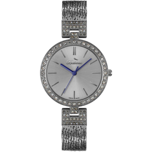 Montre femme à bracelet maille acier, cadran argenté et lunette sertie de strass.