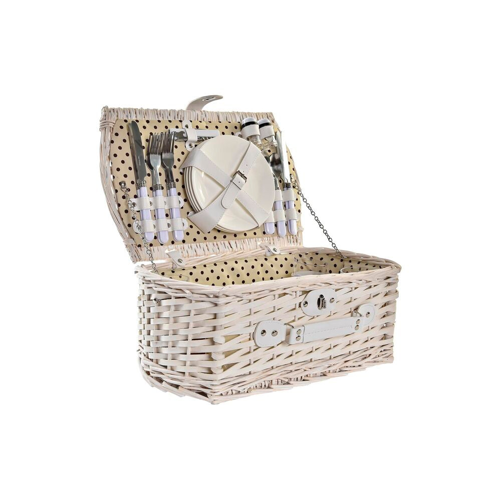 Panier pique-nique en osier blanc et beige, intérieur à pois et accessoires de table.