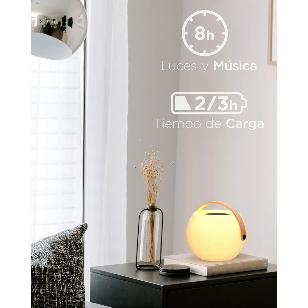 Enceinte Bluetooth portable ronde, dessus noir, poignée orange, placement sur socle.