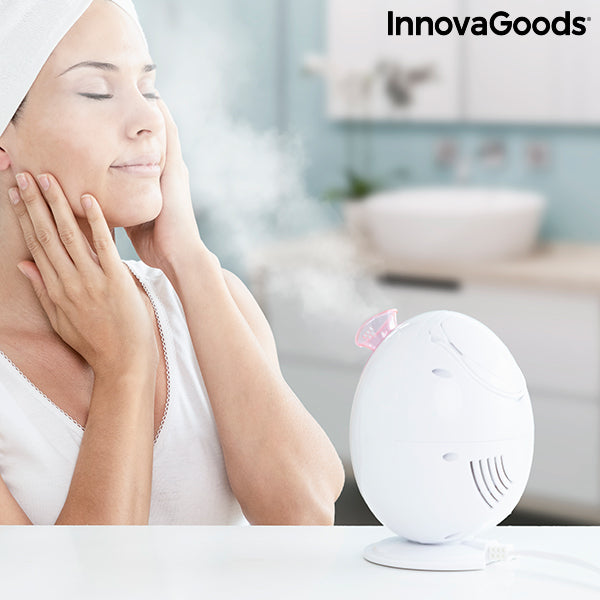 Sauna facial électrique blanc : vapeur et lumière LED rose près du visage