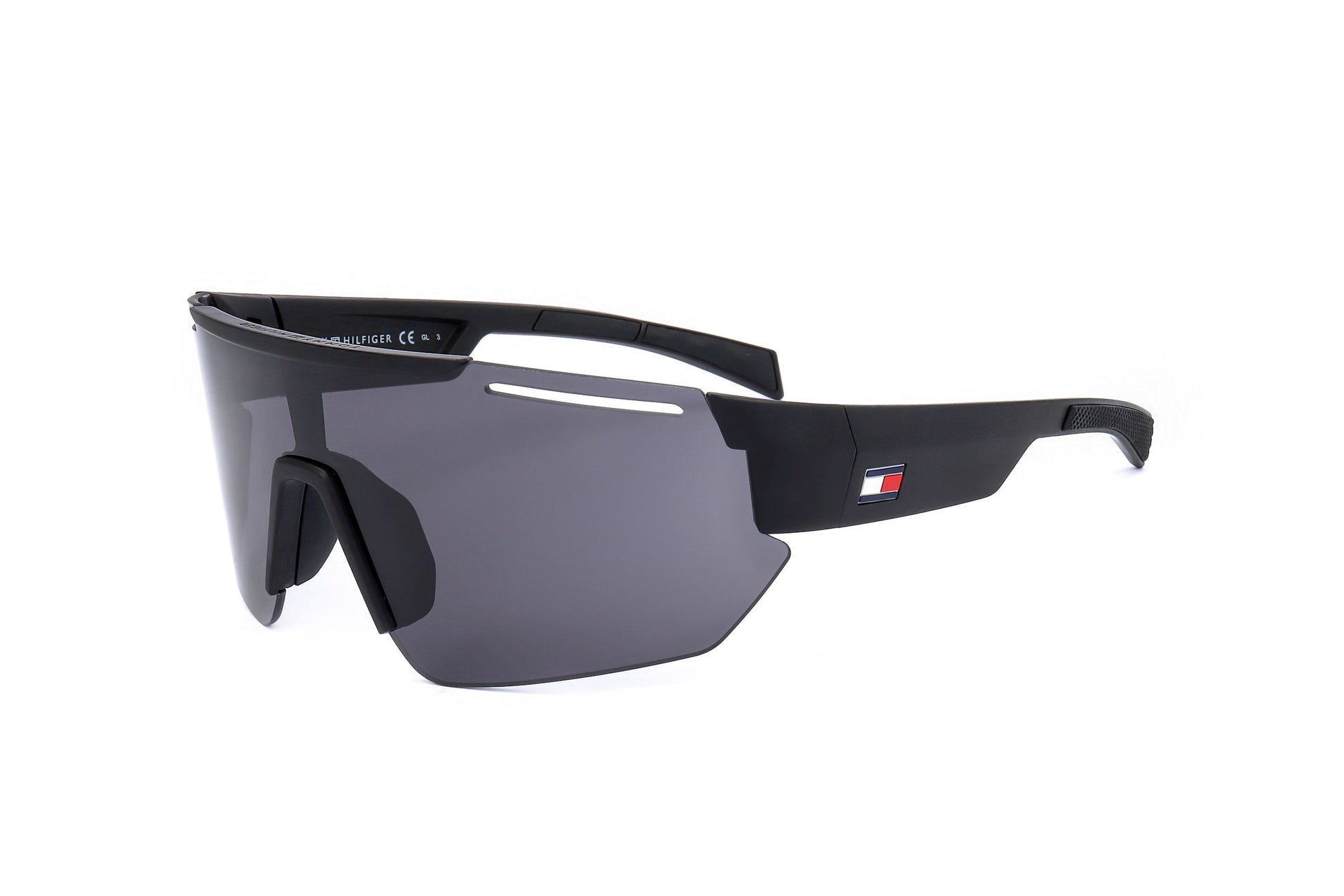 Lunettes de soleil Tommy Hilfiger noires mates, verres fumés, branche avec logo.