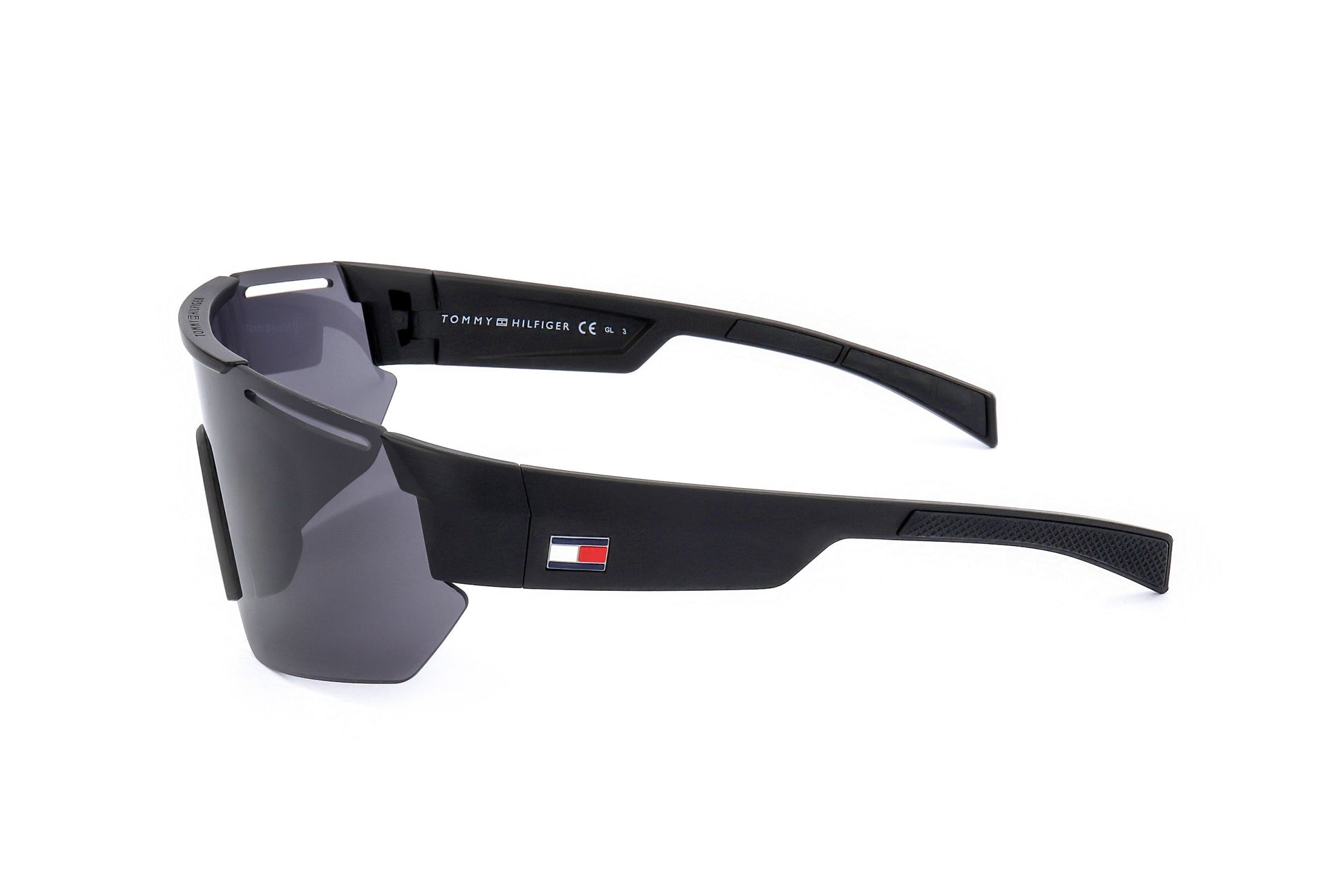 Lunettes de soleil Tommy Hilfiger noires mates, verres fumés, logo sur la branche.