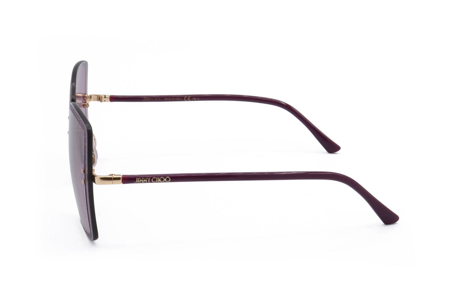 Lunettes de soleil femme, monture métal or prune avec branches incurvées, verres.