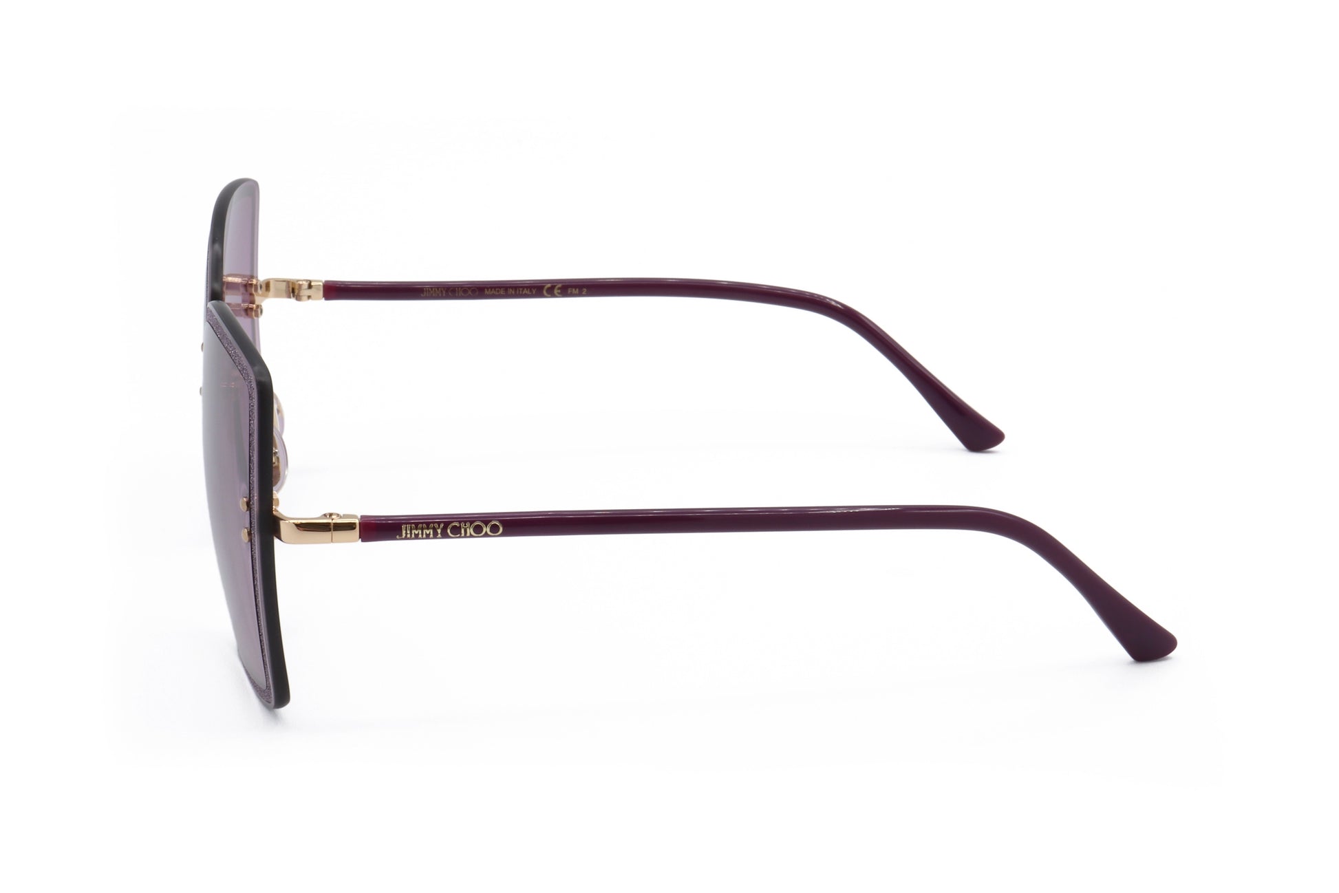 Lunettes de soleil femme, monture métal or prune avec branches incurvées, verres.