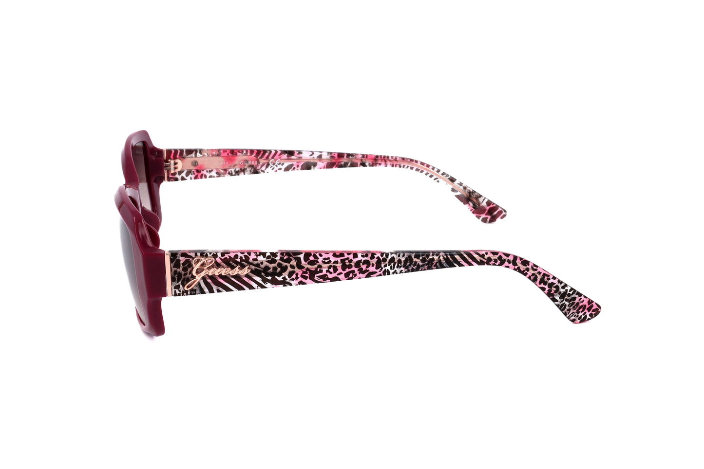 Lunettes de soleil Guess femme, vue de côté, monture rose, branches motif léopard.