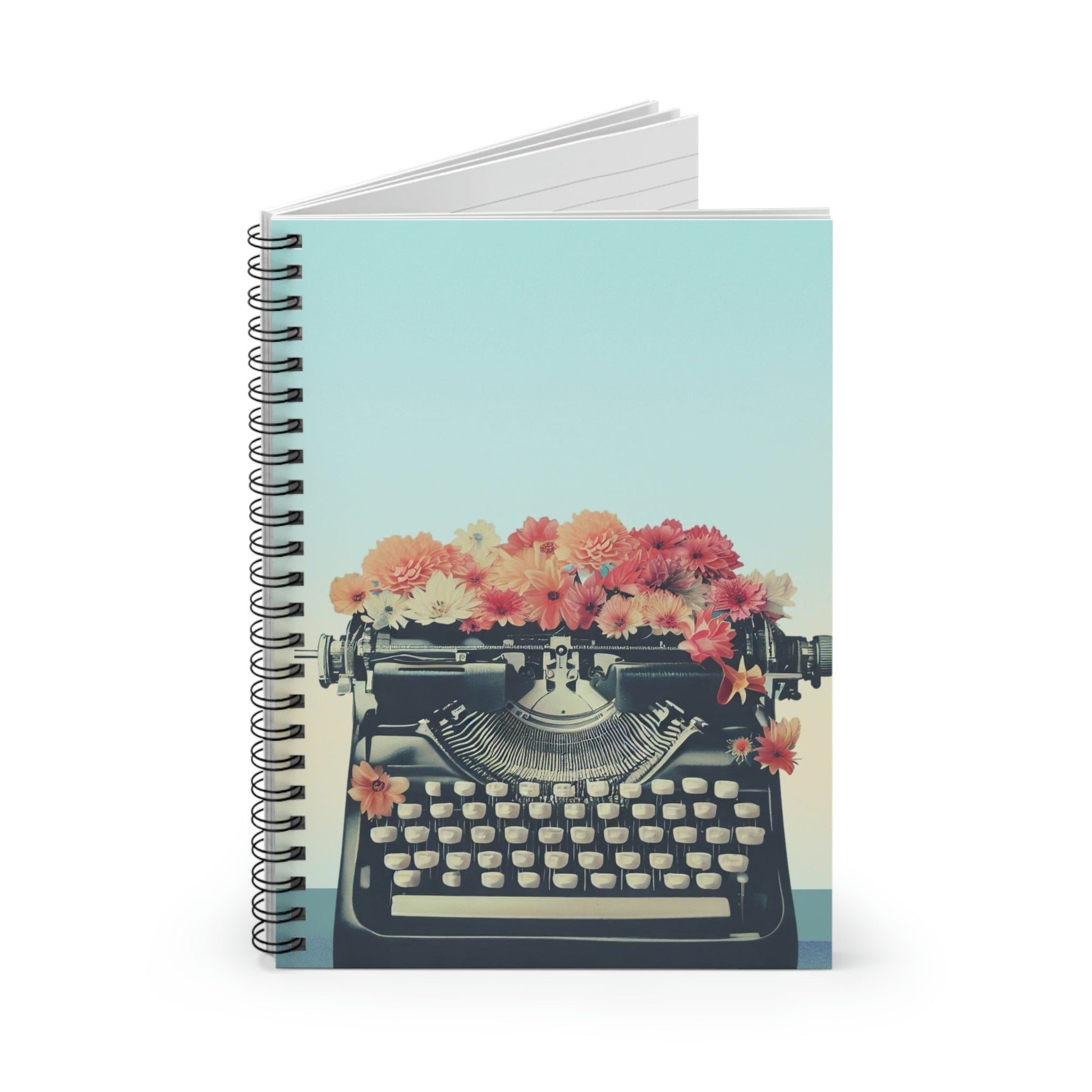 Carnet spiralé rétro bleu menthe, machine à écrire noire et fleurs multicolores sur la couverture