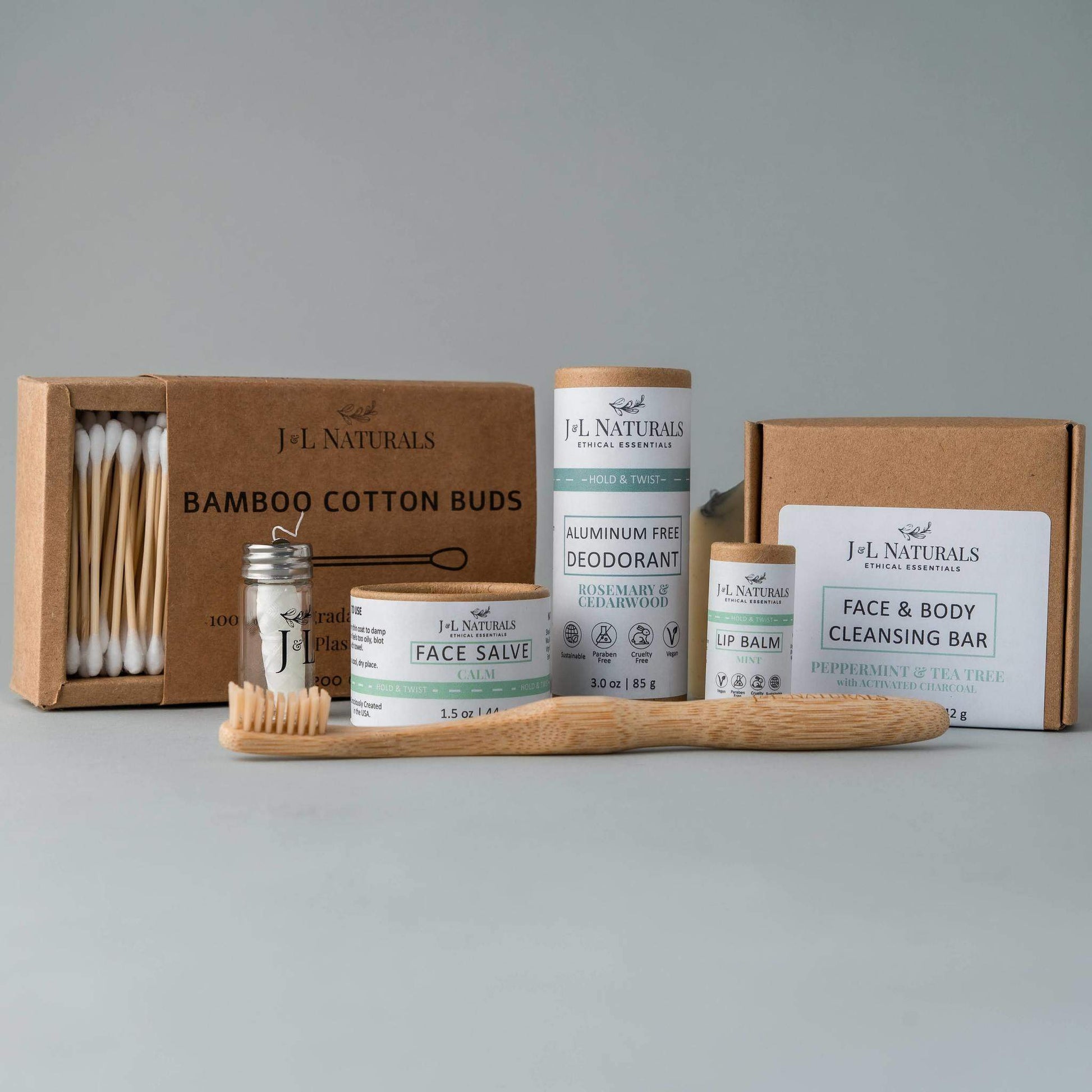 Coffret de soins J.L. Naturals sur plateau : déodorant, crème/baume, savon nettoyant visage