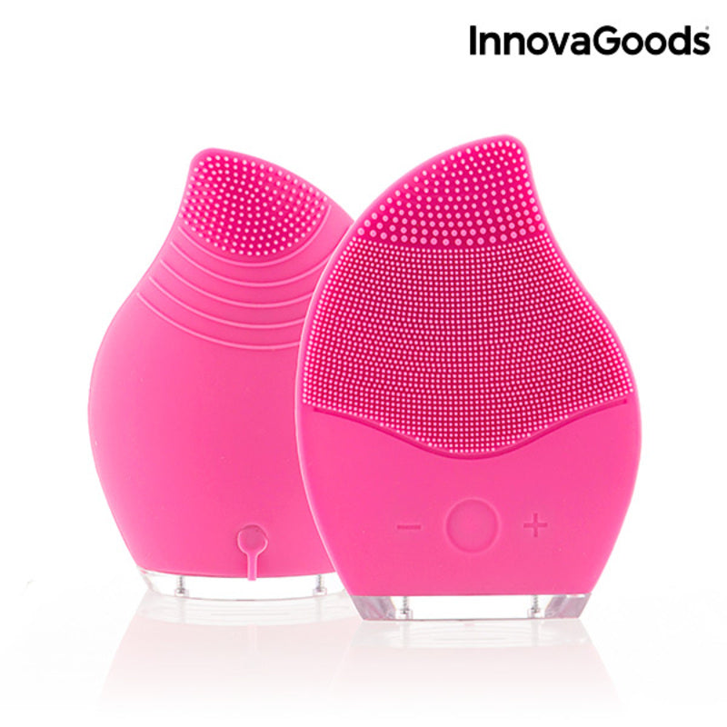 Masseur nettoyant facial rechargeable rose à picots, avec deux têtes souples.