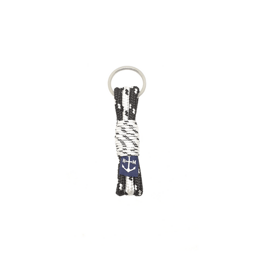 Porte-clés en corde tressée noir et blanc avec ancre, anneau en métal.