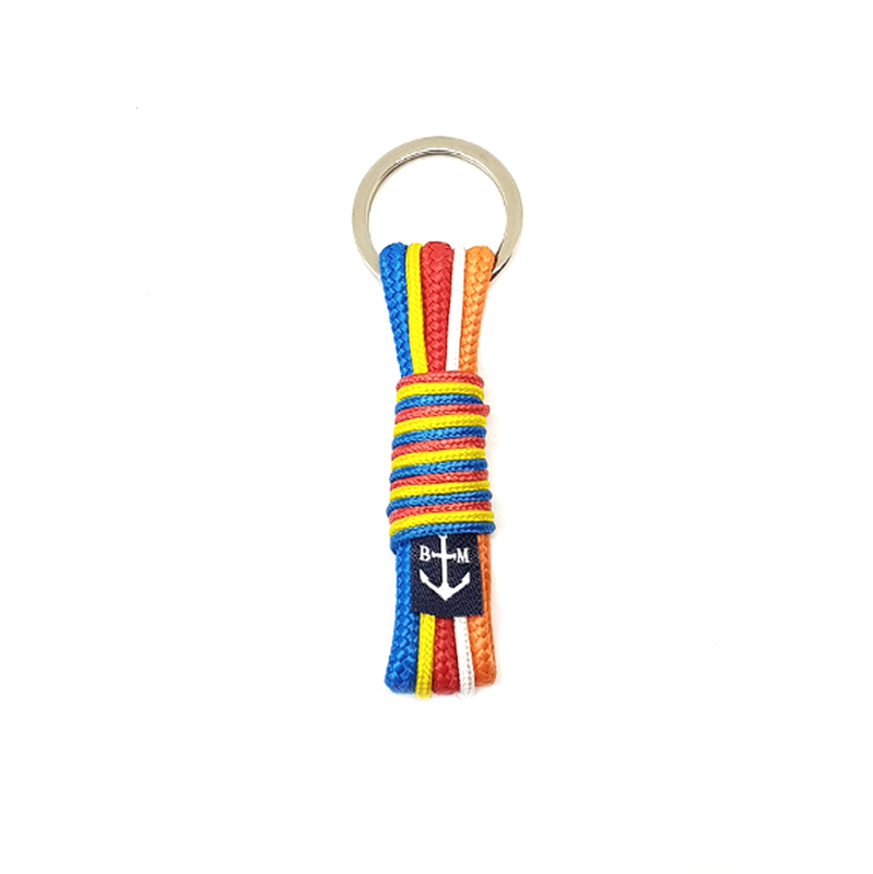 Porte-clés bouddhiste fait main en corde multicolore, anneau métal et pendentif à motif.