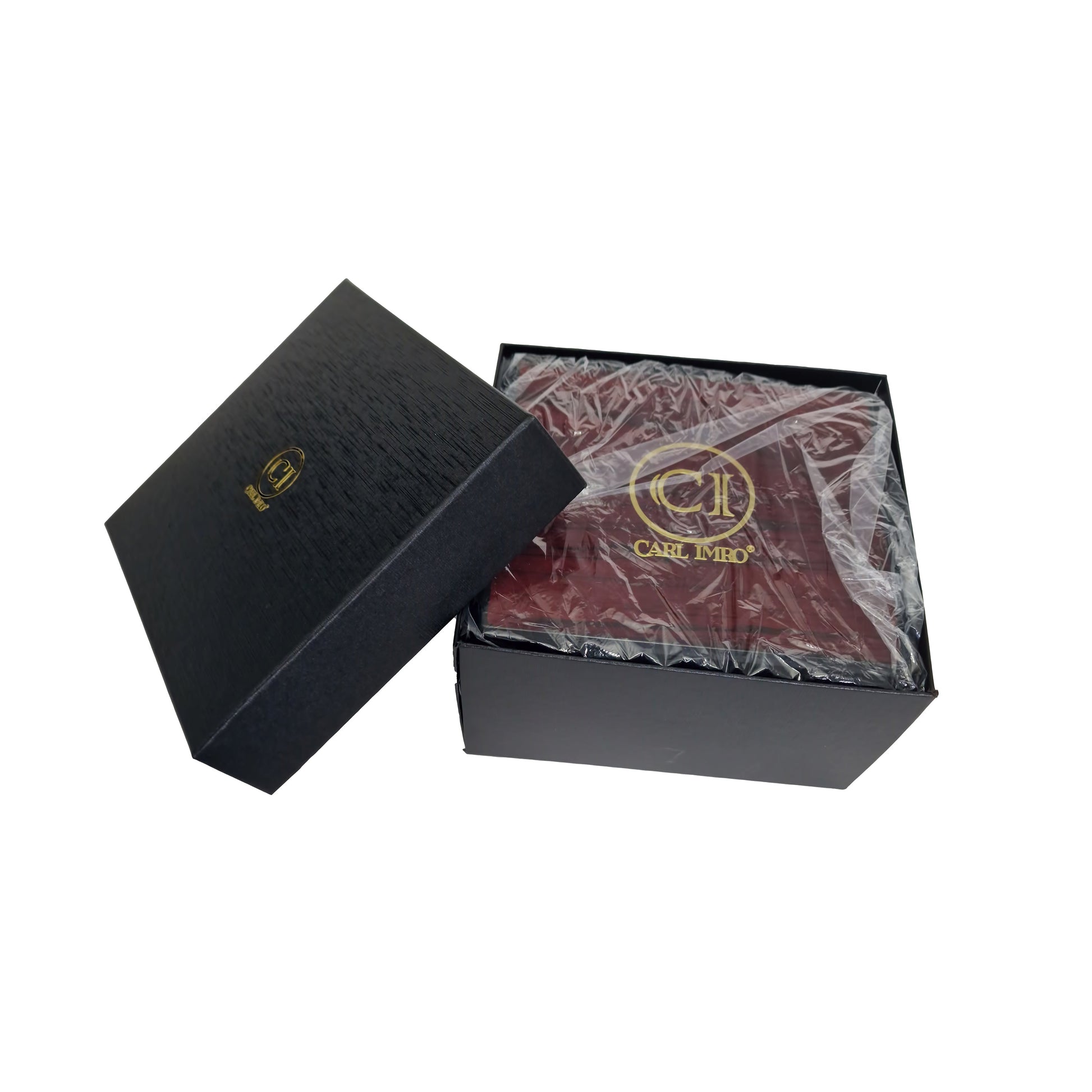 Coffret de montre noir avec couvercle ouvert et intérieur rouge.