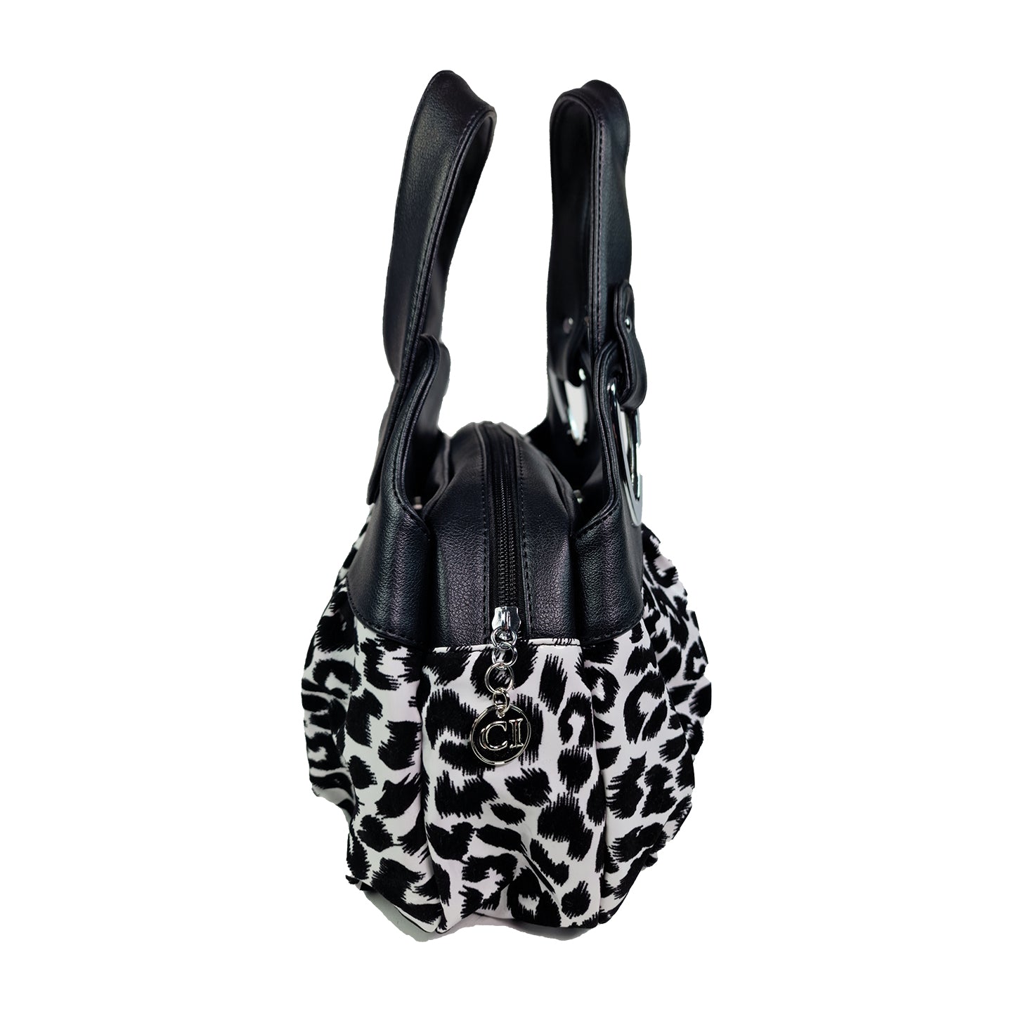 Sac à main femme imprimé léopard noir et blanc, anses noires et détail métallique.