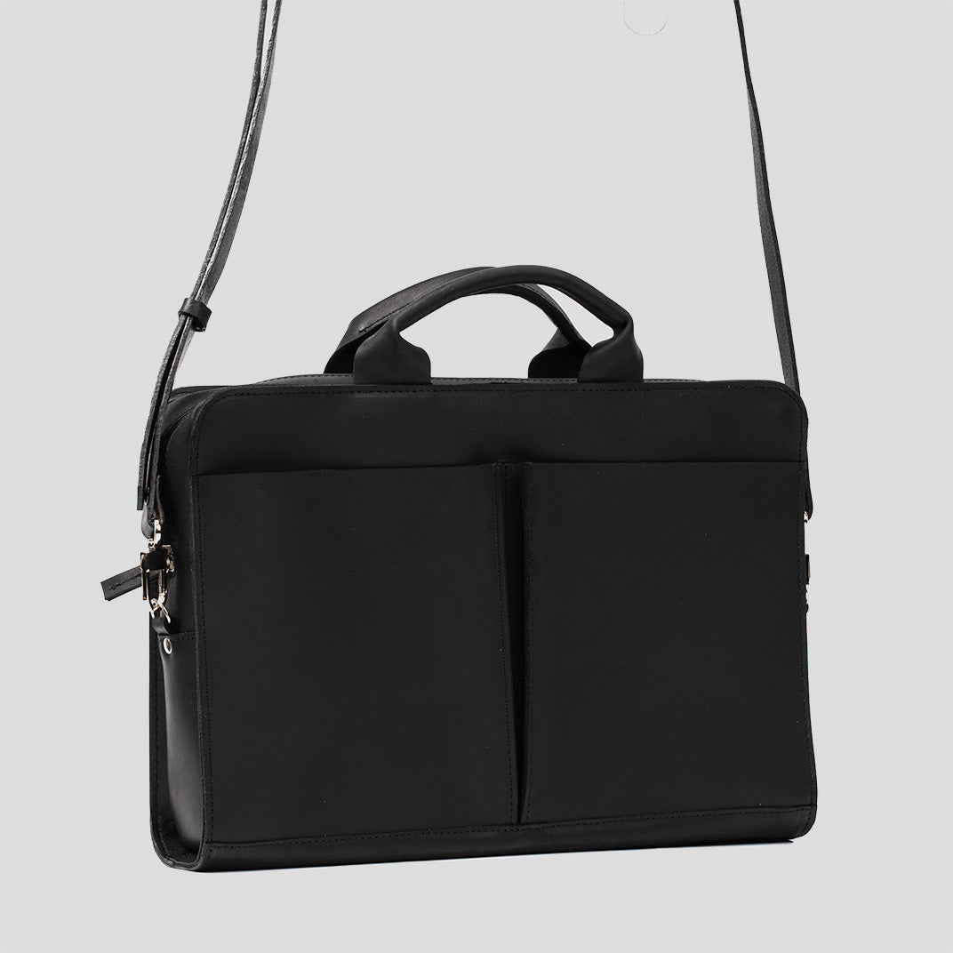 Sac ordinateur en cuir noir avec poignées et deux panneaux avant zippés