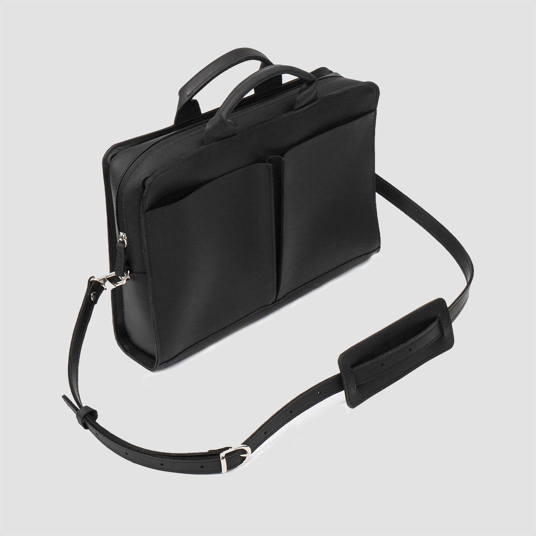 Sac ordinateur en cuir noir avec bandoulière et fermeture éclair sur le côté