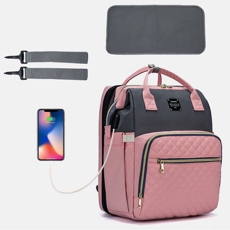 Sac à langer bébé rose poudré avec matelas à langer, poches zippées et anses