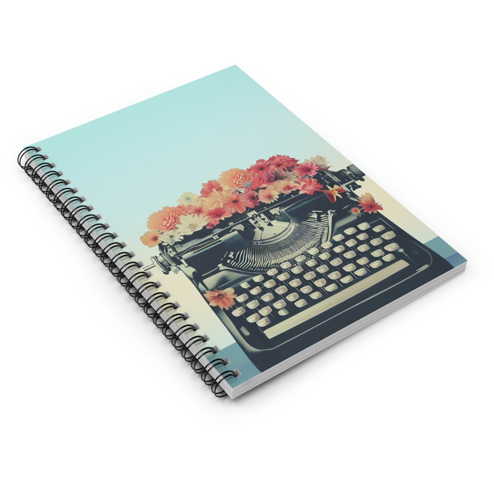 Carnet spiralé bleu menthe avec couverture illustrée machine à écrire noire et fleurs colorées