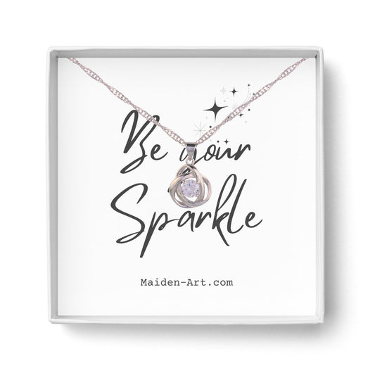 Collier à pendentif nœud rond argenté avec pierre cubique scintillante