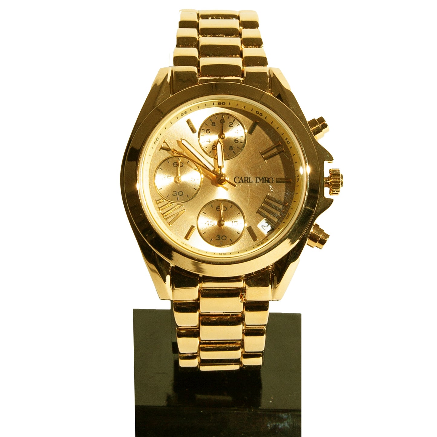 Montre femme cadran doré détaillé, boîtier doré et bracelet maillons rectangulaires.