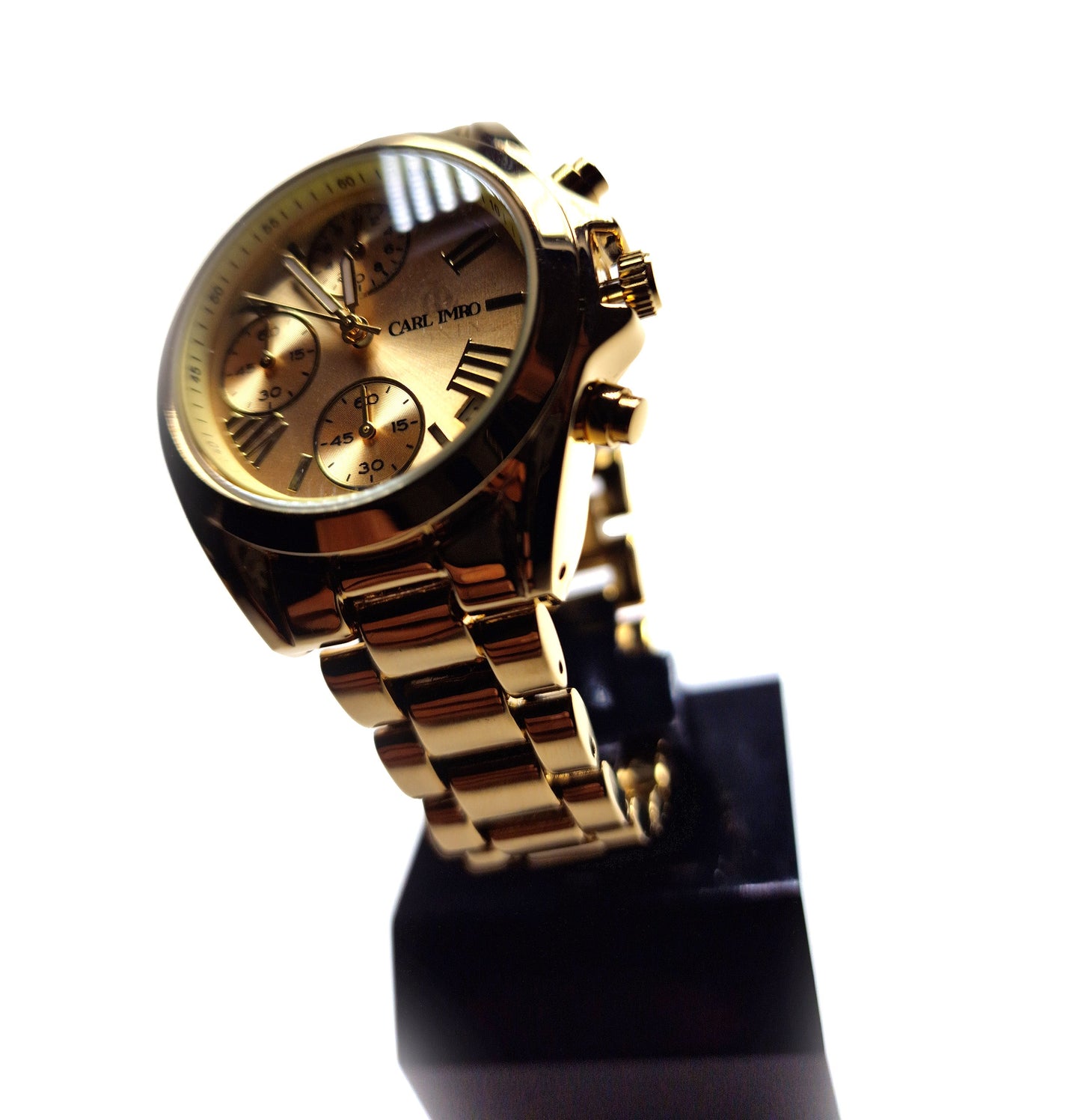 Montre femme à bracelet maillons métalliques dorés, cadran doré à trois compteurs