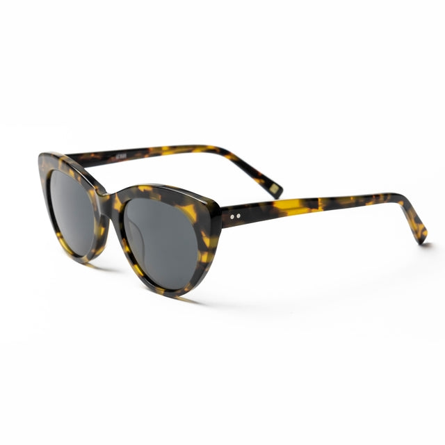 Lunettes œil-de-chat en acétate écaille jaune, verres teintés gris foncé, vue de côté