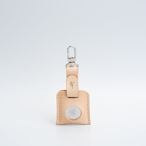 Porte-clés en cuir beige avec mousqueton argenté et fenêtre ronde AirTag